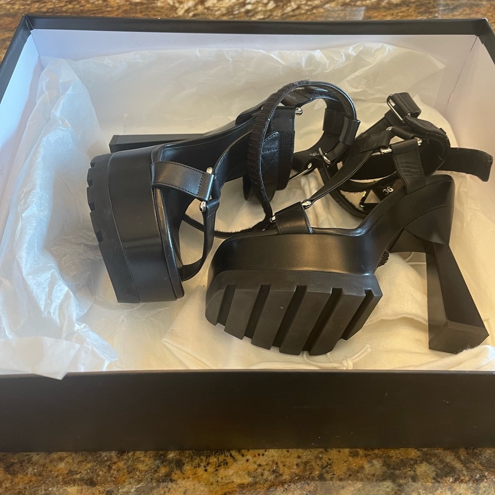 Versace black platform sandals. Size 6 Worn one time . Excellent condition.